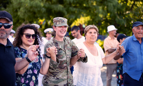 Female in uniform with family members