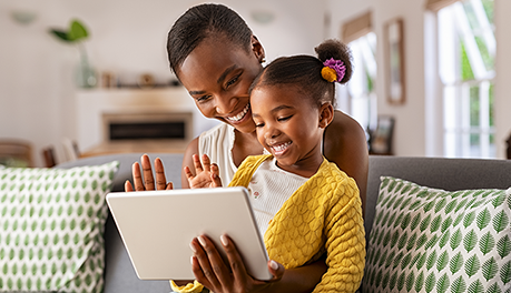 mother and child using tablet computer