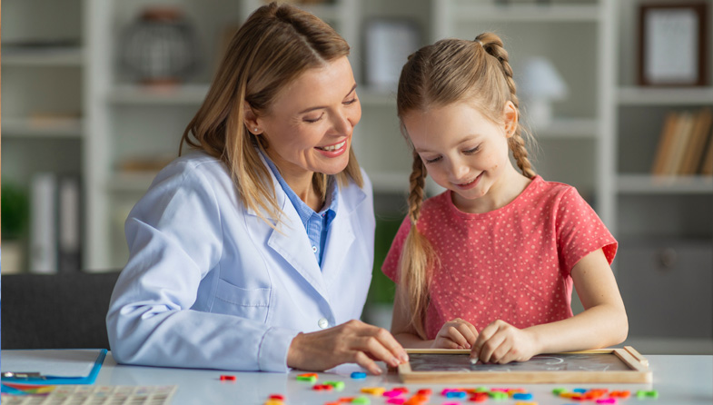 provider and child using chalkboard