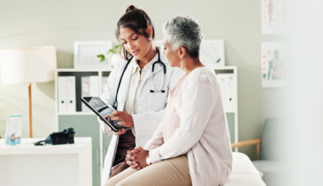 female health care provider talking to female patient