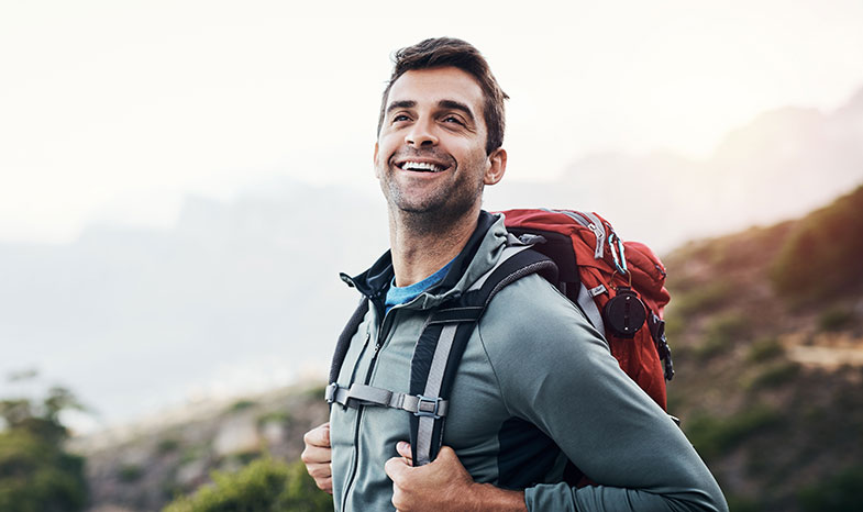 smiling man hiking