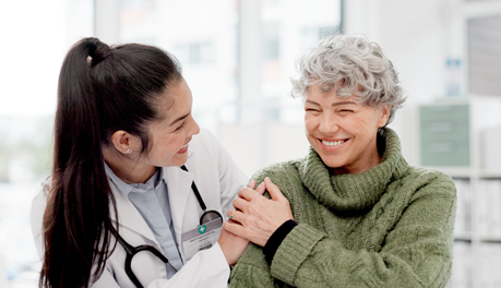 Female provider smiling with female patient