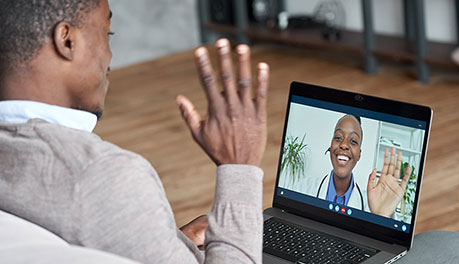 man on video call on computer
