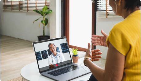 person addressing doctor on laptop screen