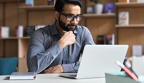 man looking at laptop screen