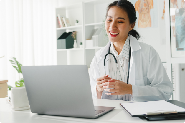 Female doctor using laptop